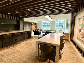 A conference room with a long table and chairs.